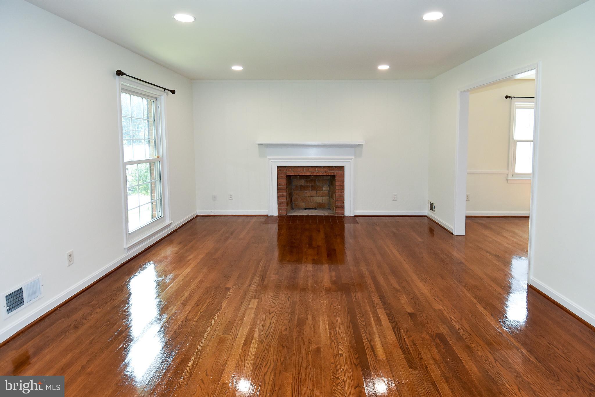 7513 Sebago Road Bethesda, MD 20817 - Photo 11 of 48 Living room with wood burning fireplace