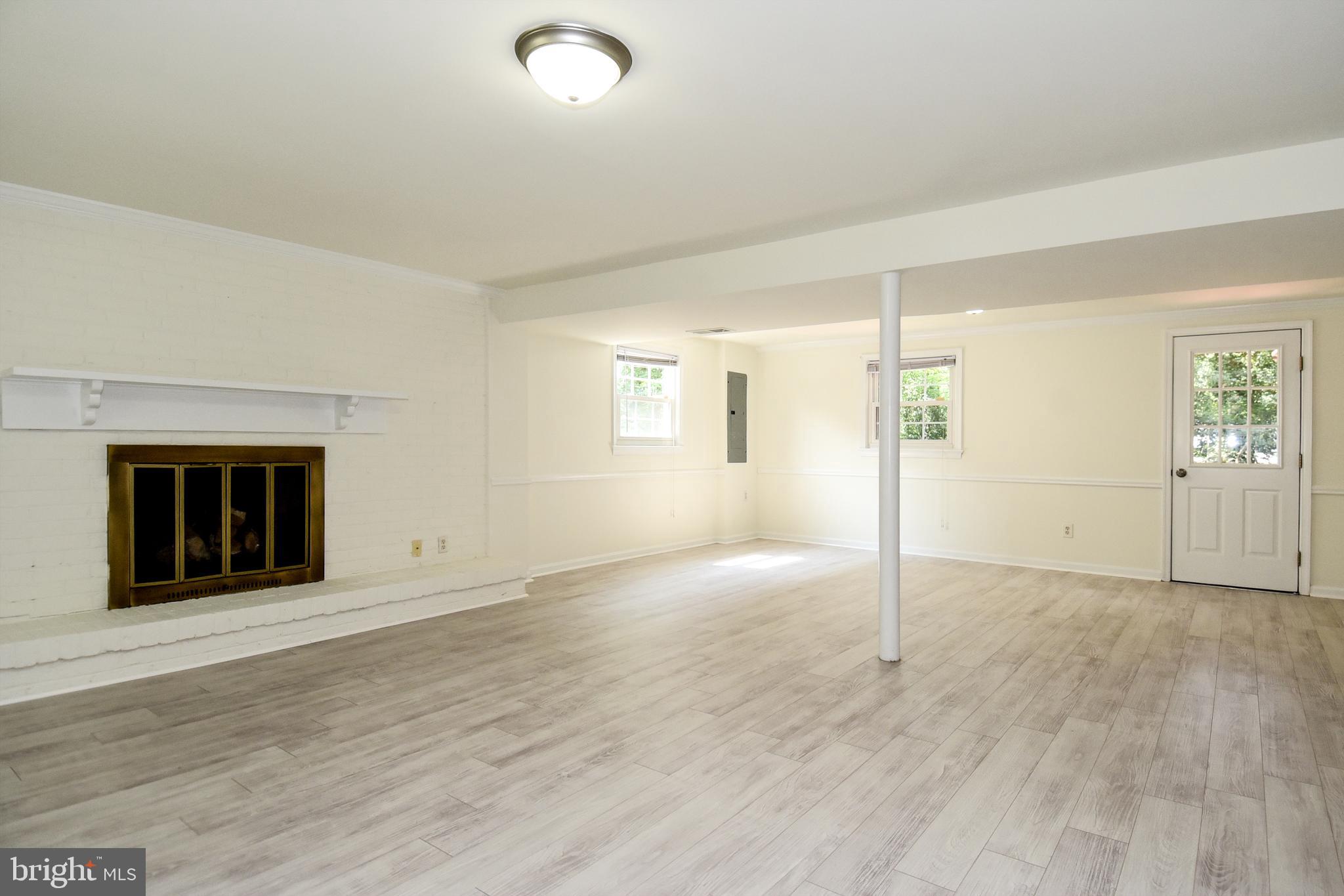 7513 Sebago Road Bethesda, MD 20817 - Photo 34 of 48 Lower level family room with woodburning fireplace