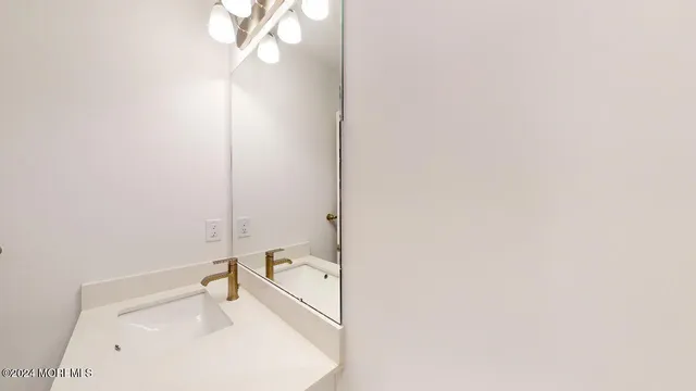 a bathroom with a sink and a vanity