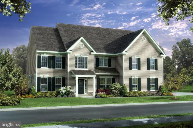a view of a white house with a yard and plants