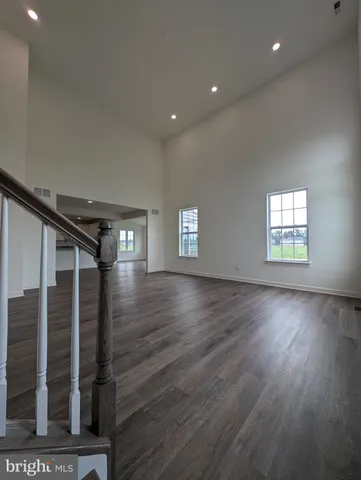 a view of kitchen with wooden floor and window