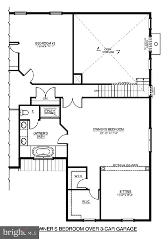 a white toilet sitting next to a sink