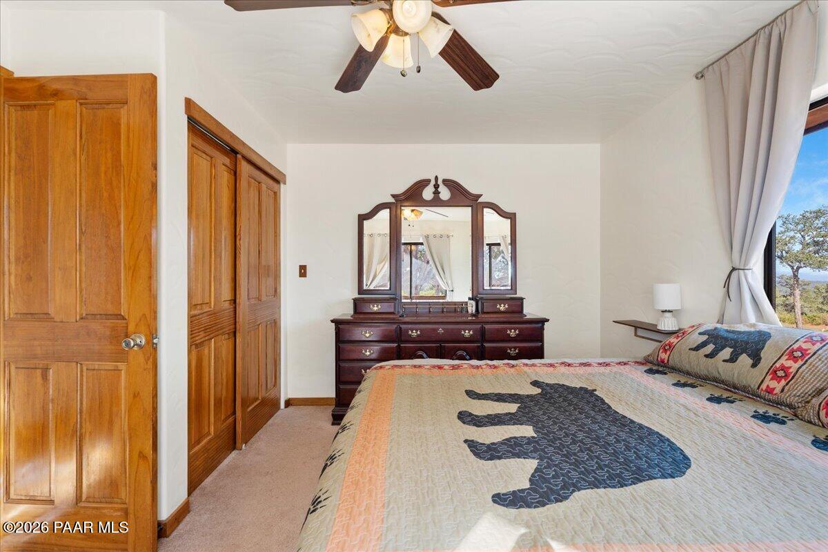 49 Norma Way Ash Fork, AZ 86320 - Photo 12 of 26 a living room with a bed furniture and a window