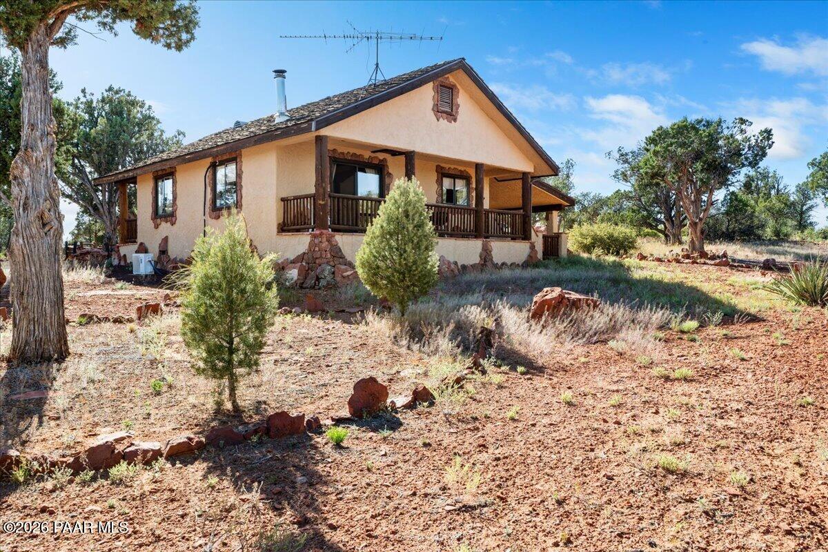 49 Norma Way Ash Fork, AZ 86320 - Photo 18 of 26 a front view of a house with a yard