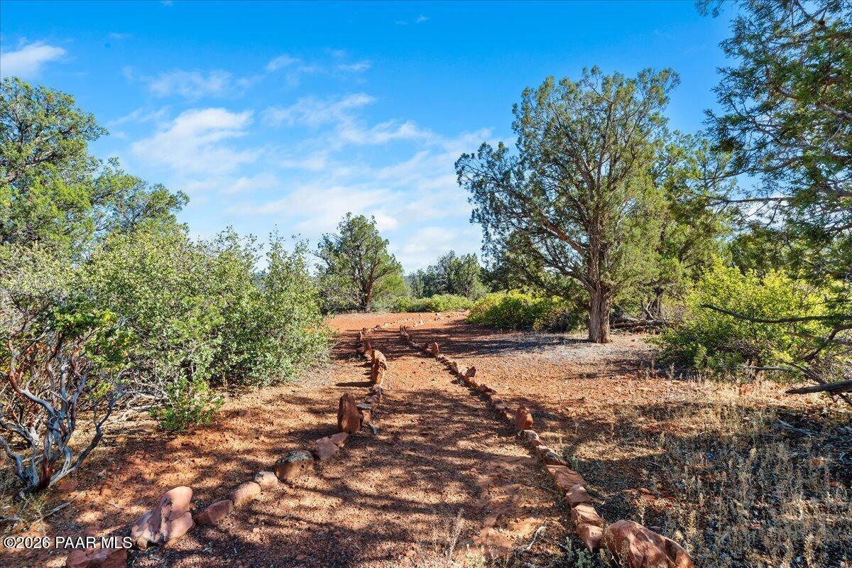 49 Norma Way Ash Fork, AZ 86320 - Photo 4 of 26 a wooden bench with view of trees