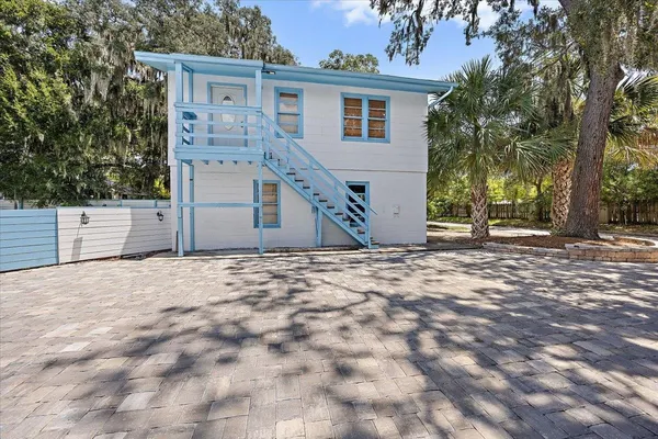 a view of a backyard of the house