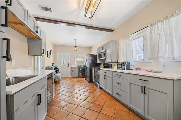 a bathroom with a toilet a sink and shower