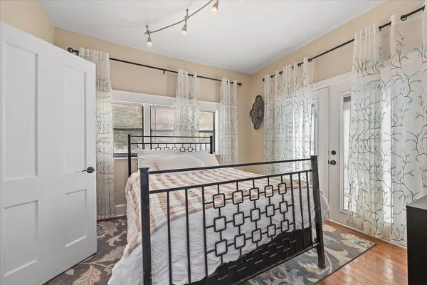 a view of a deck with chairs and wooden floor