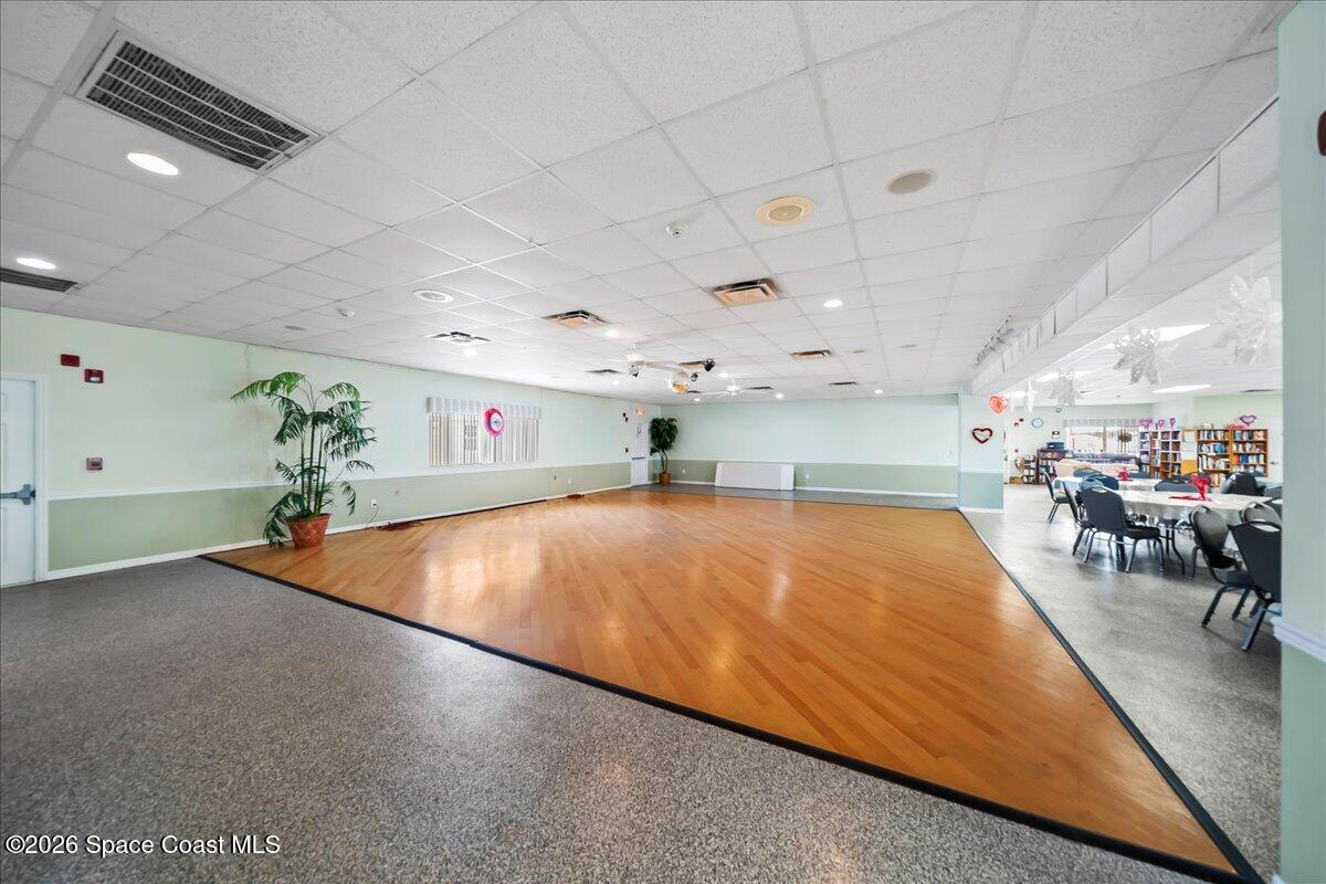 1740 Seagrape Street Northeast Palm Bay, FL 32905 - Photo 25 of 33 a room with lots of table and chairs
