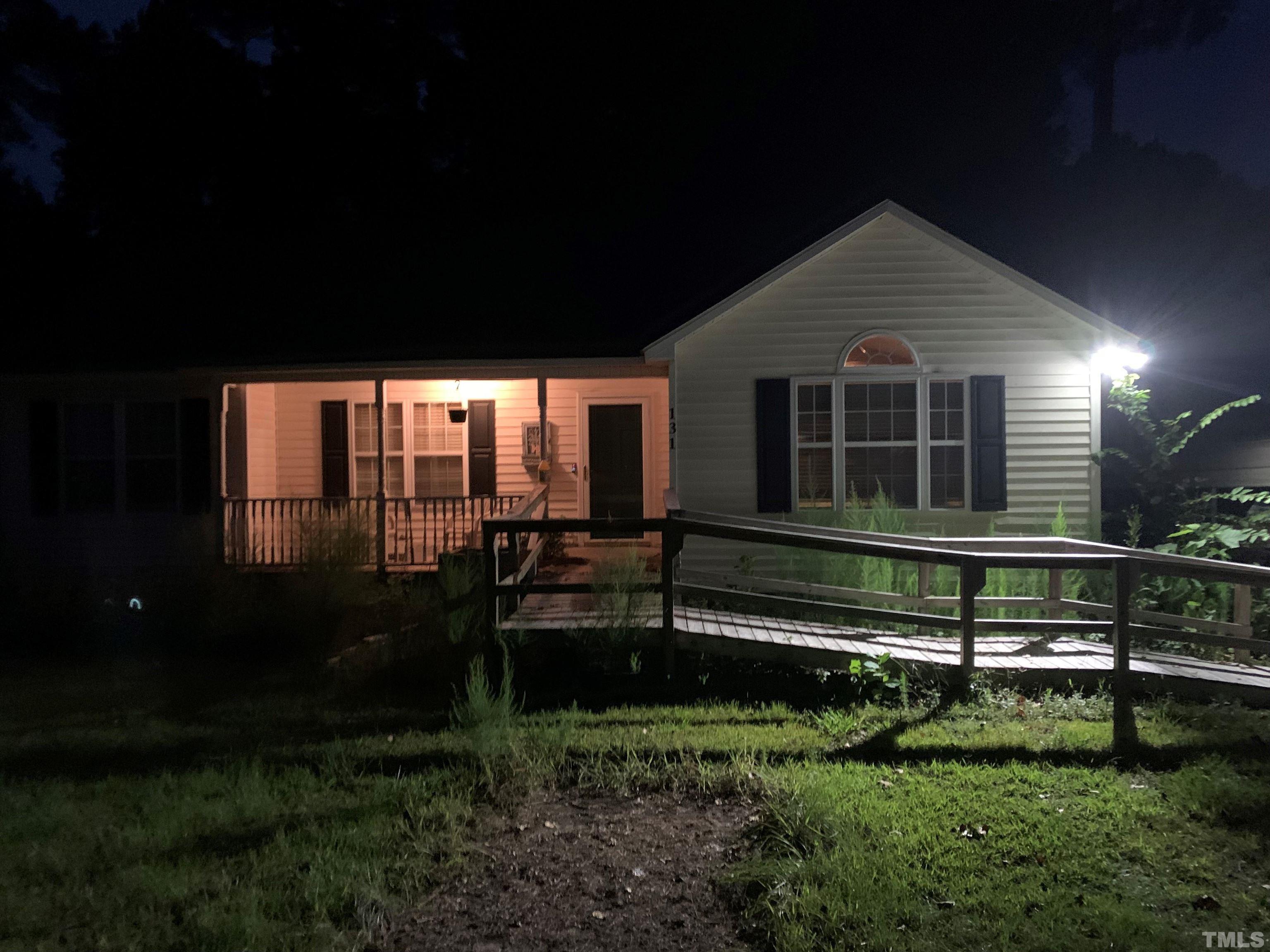 131 Forest Ridge Drive Willow Spring, NC 27592 - Photo 2 of 22 a view of a house with backyard and sitting area