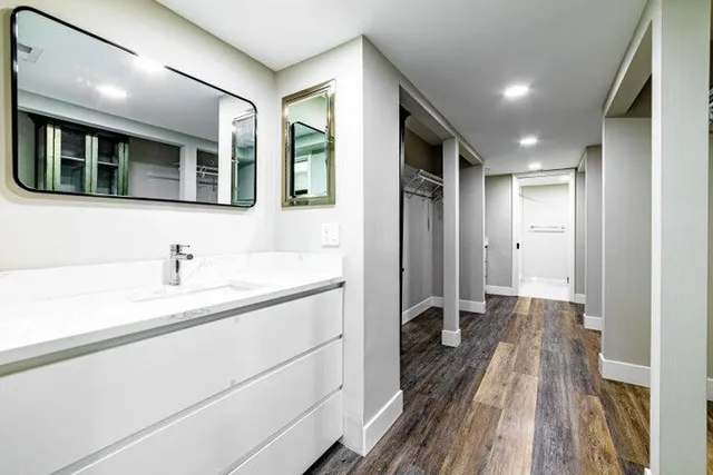 a bathroom with a sink and a mirror