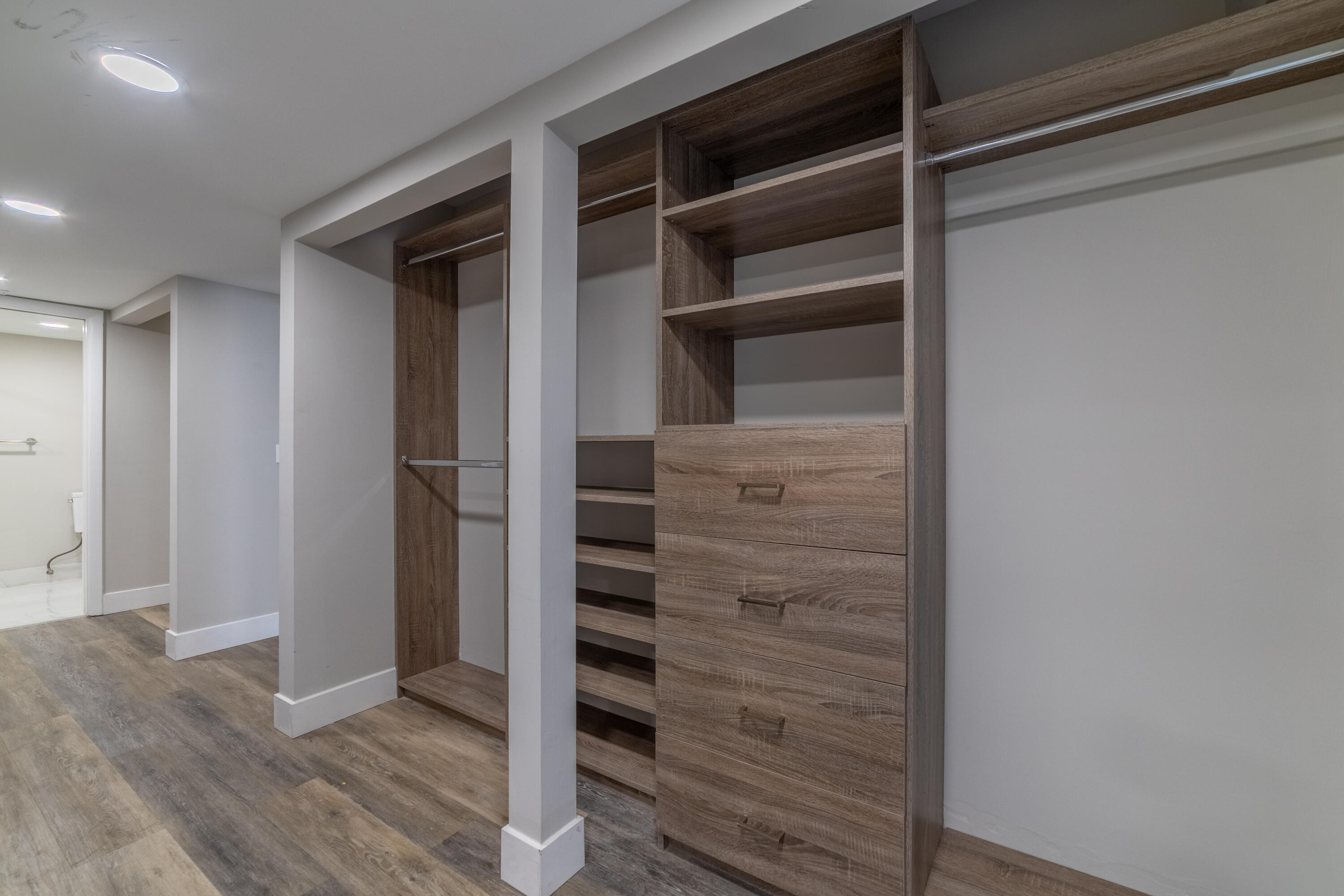 2517 Presidential Way, Unit B West Palm Beach, FL 33401 - Photo 26 of 45 a view of walk in closet with empty racks