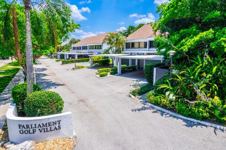 2517 Presidential Way, Unit B West Palm Beach, FL 33401 - Photo 43 of 45 a view of a house with garden and a bench