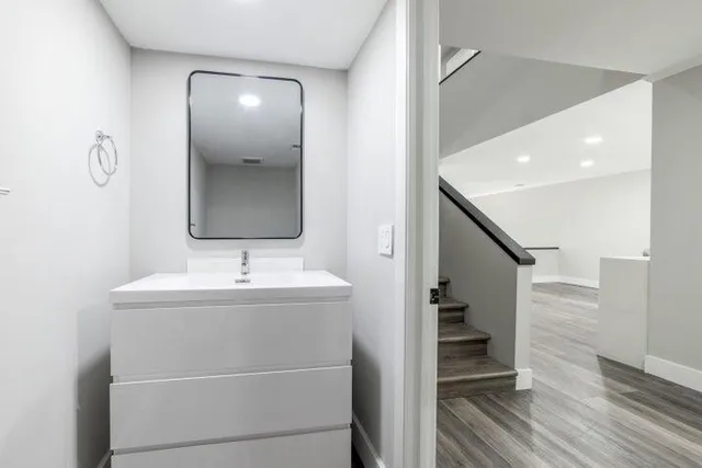 a bathroom with a sink and a mirror