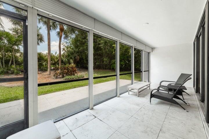 2517 Presidential Way, Unit B West Palm Beach, FL 33401 - Photo 9 of 45 a view of a room with porch and furniture