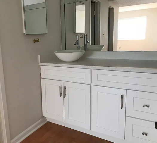 a bathroom with a sink and a mirror