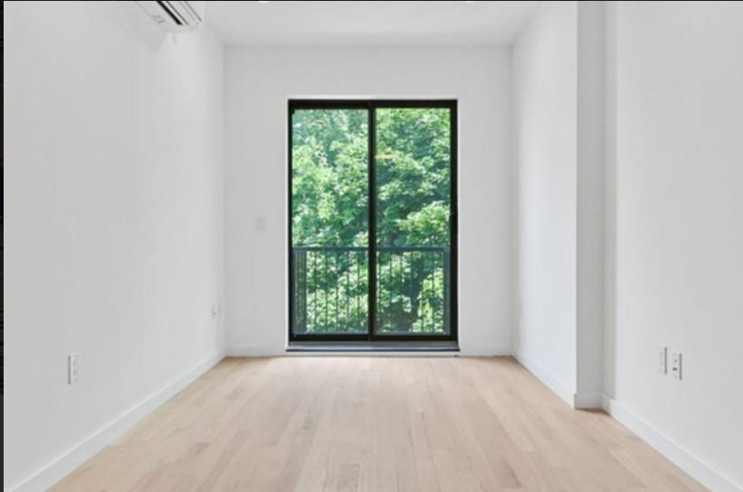1115 Hancock Street Brooklyn, NY 11221 - Photo 13 of 33 a view of an empty room with a window