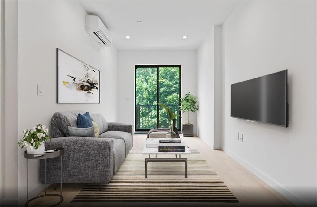 1115 Hancock Street Brooklyn, NY 11221 - Photo 7 of 33 a living room with furniture and a flat screen tv