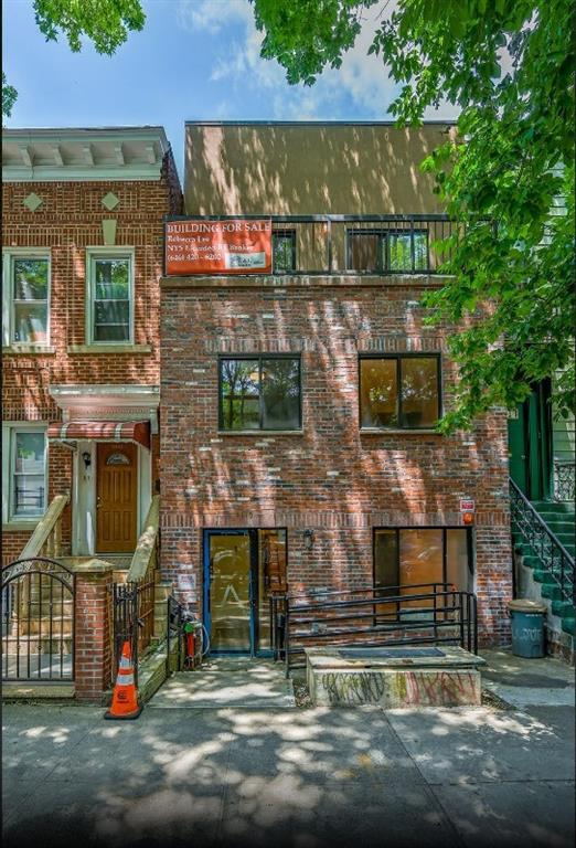 1115 Hancock Street Brooklyn, NY 11221 - Photo 8 of 33 a front view of a house with a yard