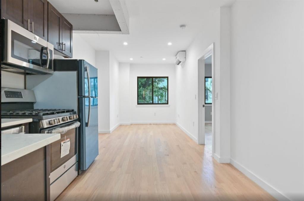 1115 Hancock Street Brooklyn, NY 11221 - Photo 10 of 33 a view of a kitchen with a sink stove and cabinets