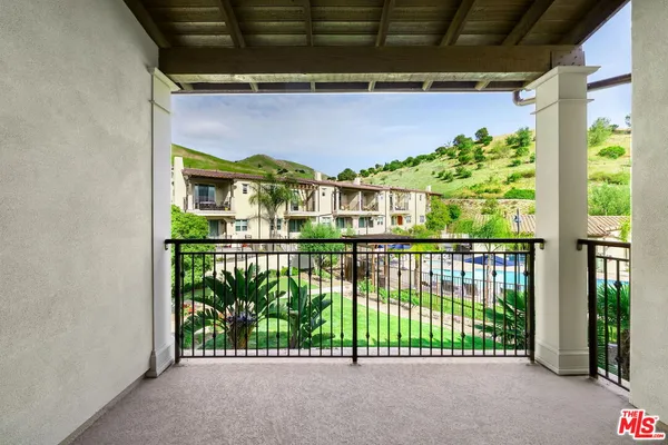 a view of a balcony with plants