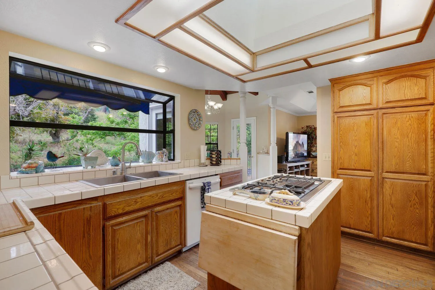 3944 Pala Mesa Drive Fallbrook, CA 92028 - Photo 16 of 39 a kitchen with a sink and a refrigerator
