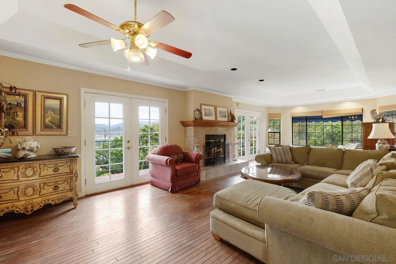 3944 Pala Mesa Drive Fallbrook, CA 92028 - Photo 10 of 39 a living room with furniture fireplace and a large window