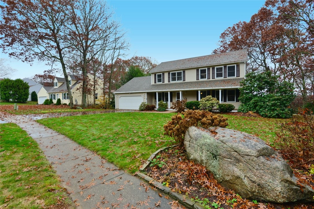 Pretty front yard includes sidewalks.