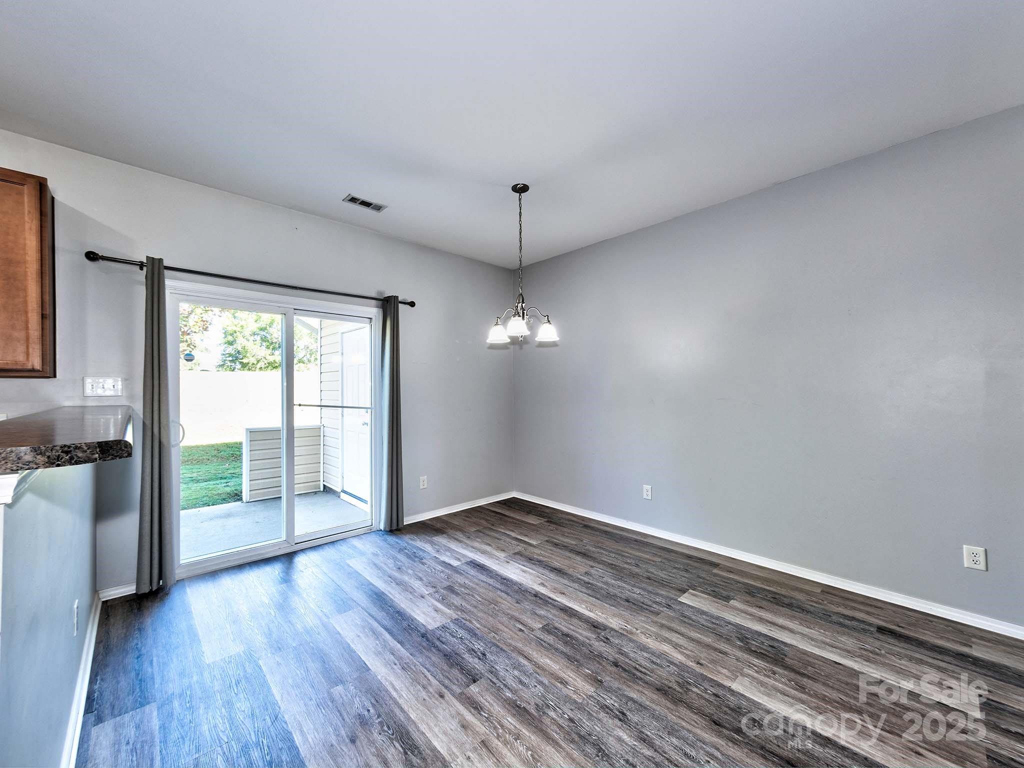290 River Clay Road Fort Mill, SC 29708 - Photo 11 of 41 wooden floor in an empty room with a window