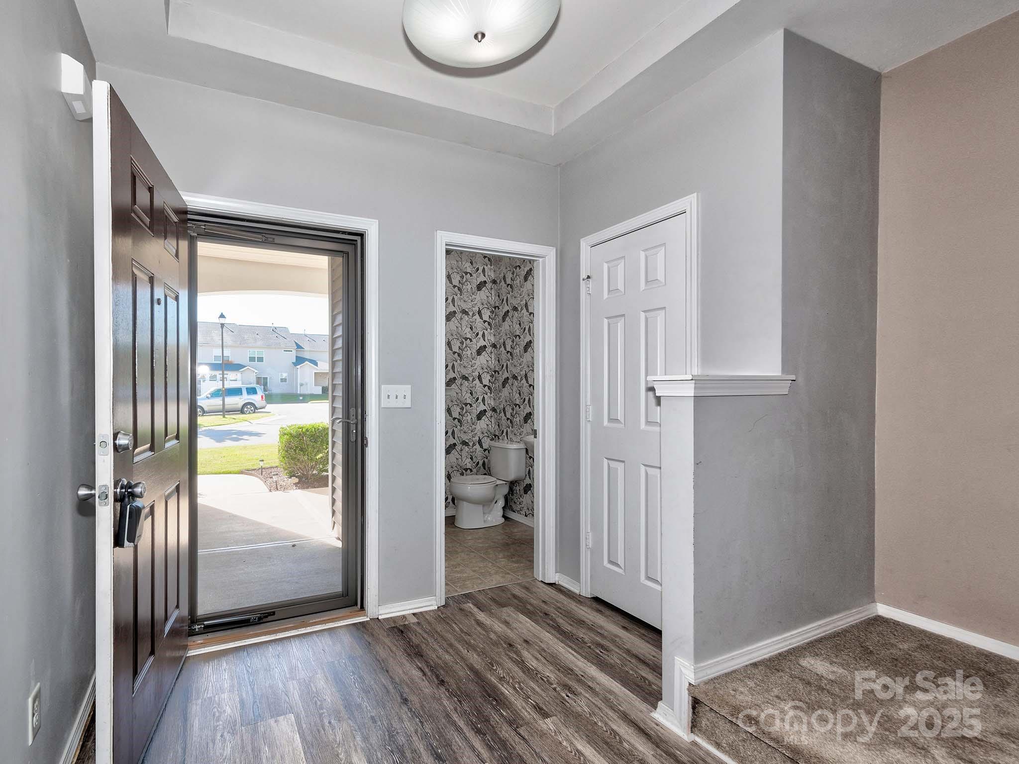 290 River Clay Road Fort Mill, SC 29708 - Photo 5 of 41 an empty room with wooden floor and windows