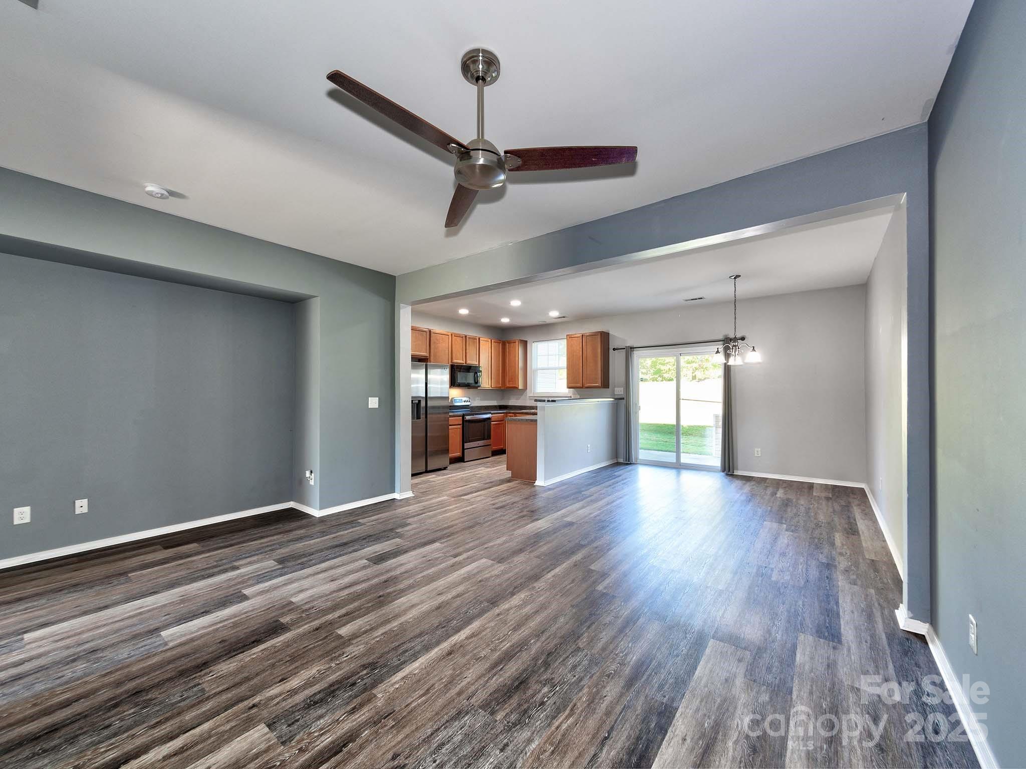 290 River Clay Road Fort Mill, SC 29708 - Photo 8 of 41 a view of a room with window wooden floor and a ceiling fan