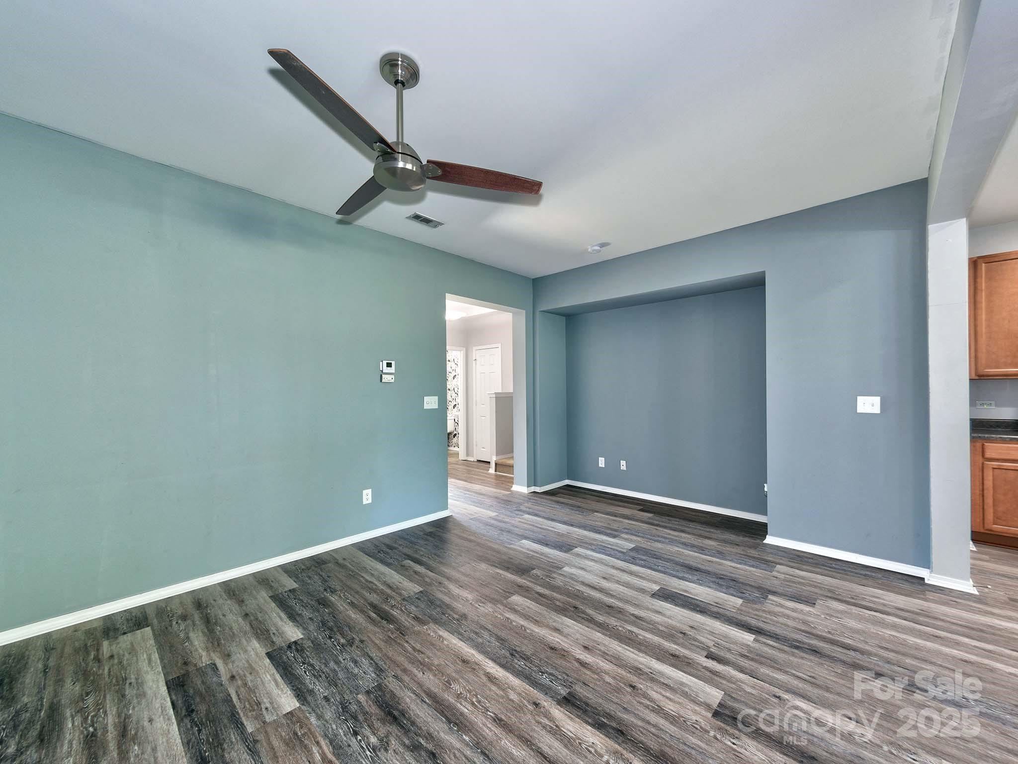 290 River Clay Road Fort Mill, SC 29708 - Photo 9 of 41 a view of an empty room with wooden floor