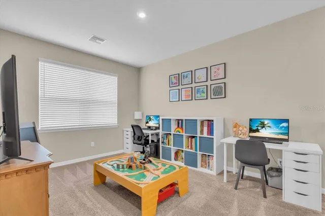a view of a room with an empty space and chair