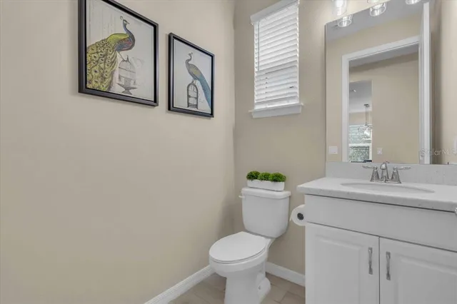 a view of a swimming pool with a patio and garden