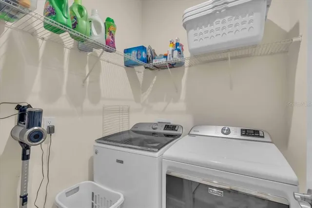 a view of a swimming pool with outdoor seating