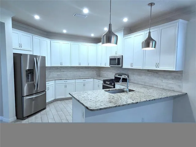 a bed room with a bed and a ceiling fan