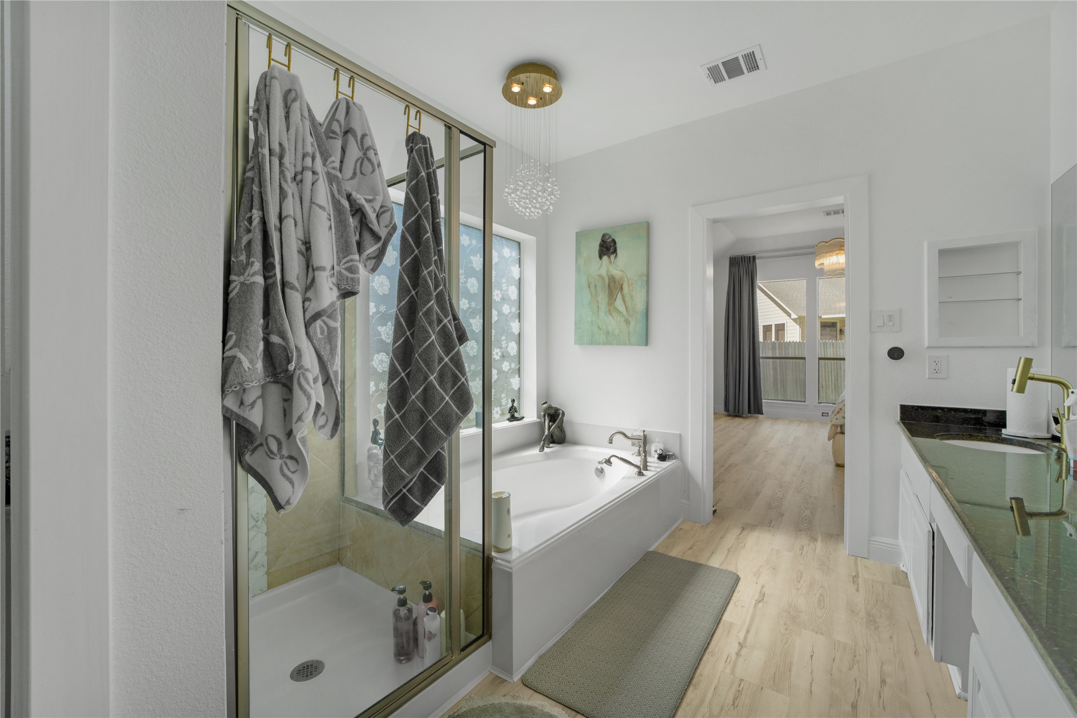 3032 Prairie Bluff Seguin, TX 78155 - Photo 13 of 23 Full bath featuring vanity, a bath, light wood-style floors, and a shower stall