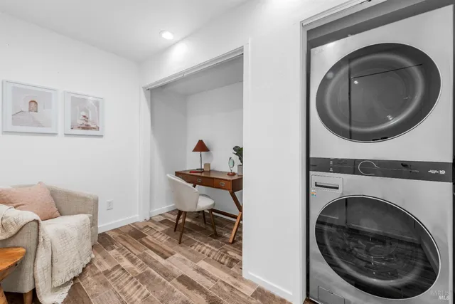 a living room with furniture and a chair