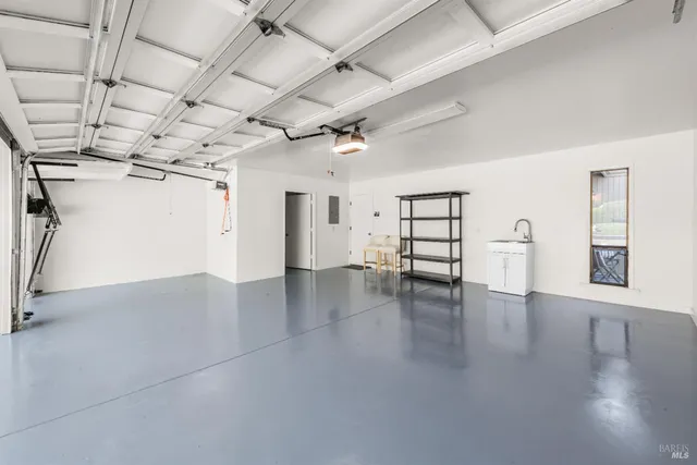 a view of a livingroom with wooden floor and windows