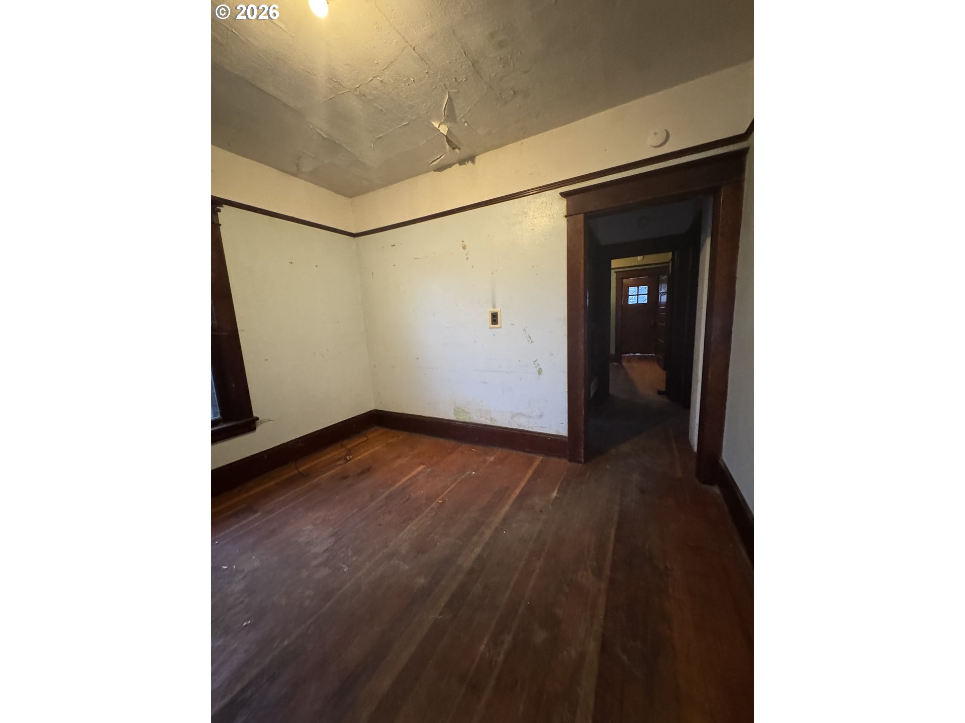 6422 Southeast Carlton Street Portland, OR 97206 - Photo 11 of 27 a view of a hallway with wooden floor