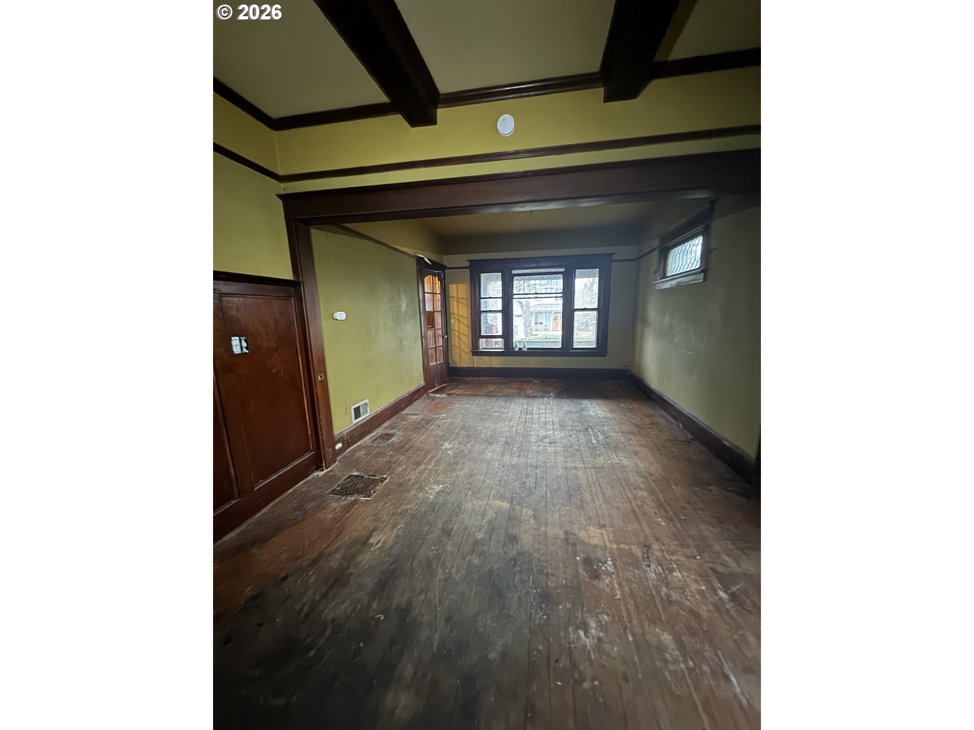 6422 Southeast Carlton Street Portland, OR 97206 - Photo 13 of 27 a view of a hallway with wooden floor and a living room
