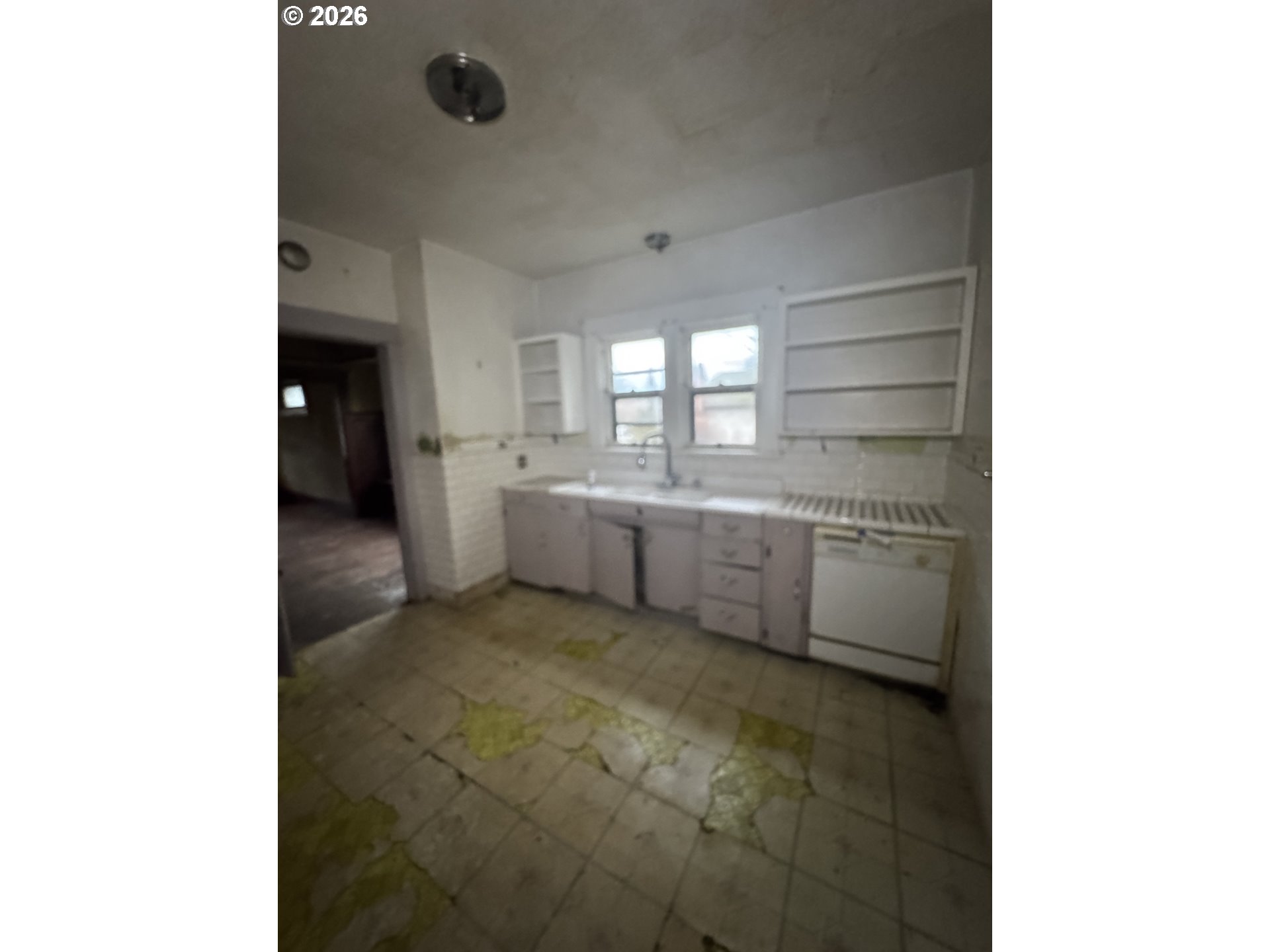 6422 Southeast Carlton Street Portland, OR 97206 - Photo 17 of 27 a kitchen with a sink cabinets and window