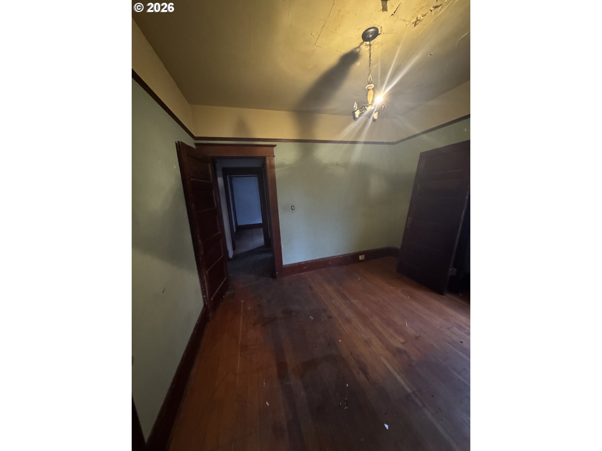 6422 Southeast Carlton Street Portland, OR 97206 - Photo 5 of 27 a view of a hallway with wooden floor