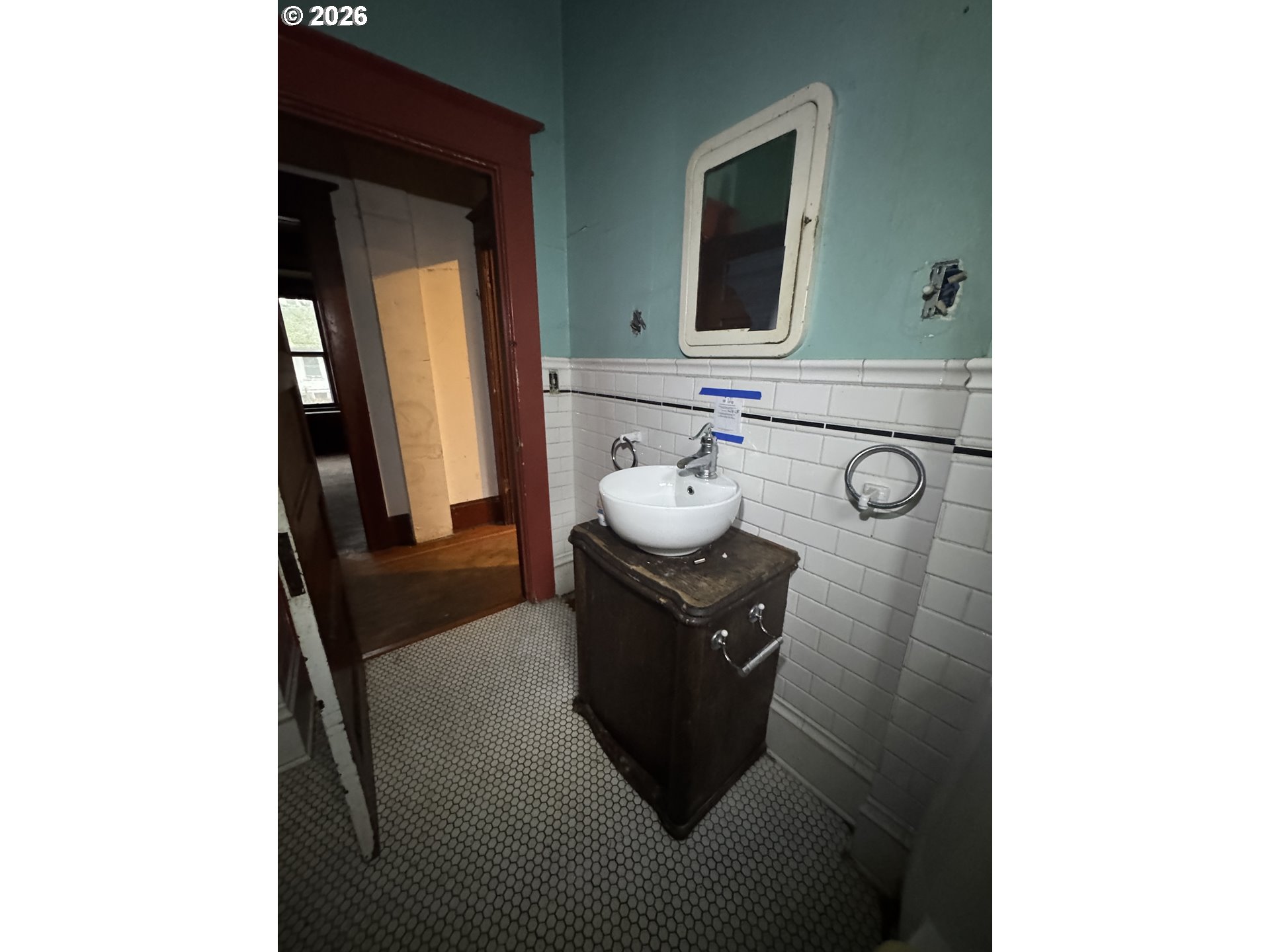 6422 Southeast Carlton Street Portland, OR 97206 - Photo 9 of 27 a bathroom with a sink and a mirror