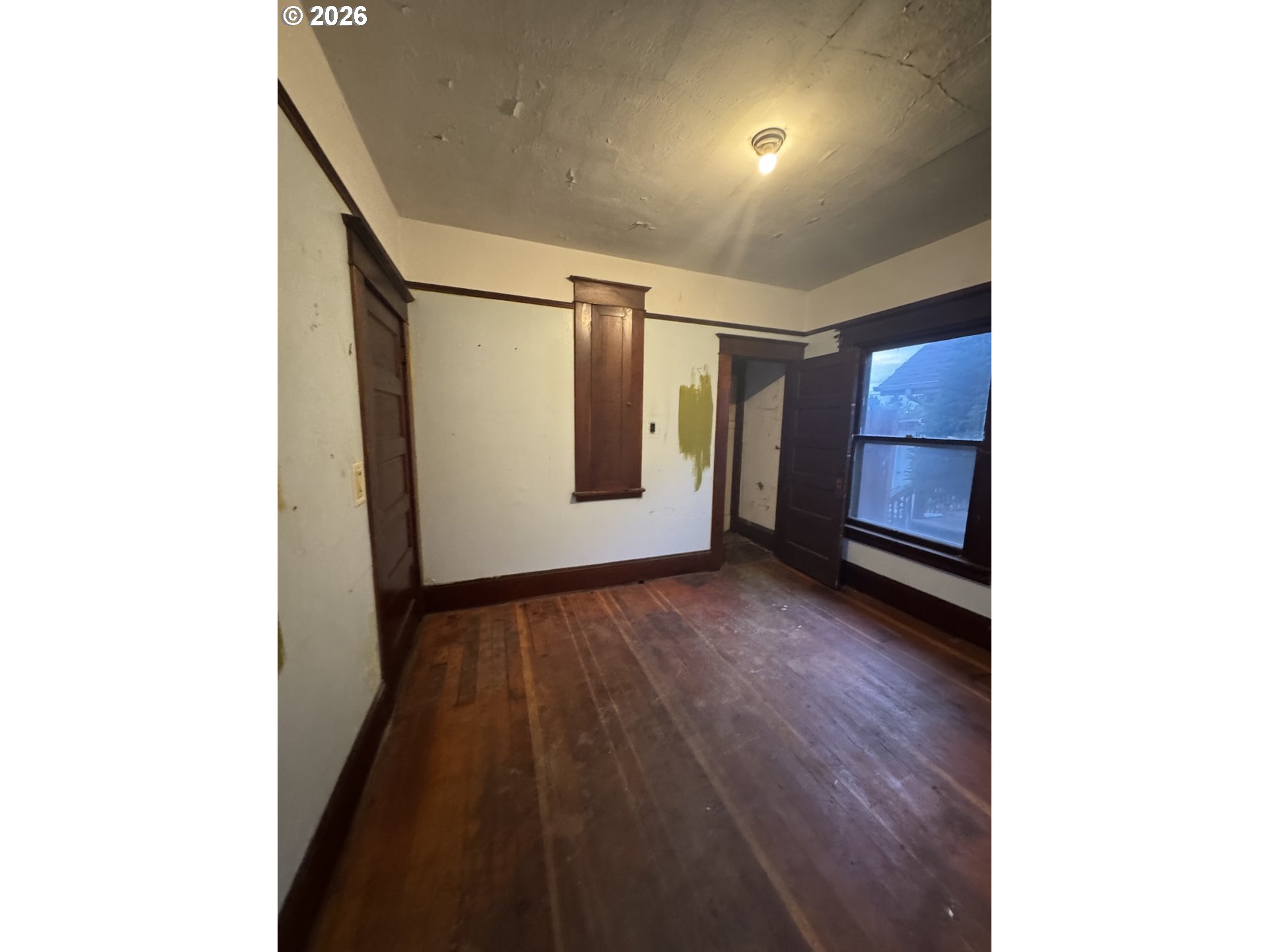 6422 Southeast Carlton Street Portland, OR 97206 - Photo 10 of 27 a view of a room with wooden floor and window