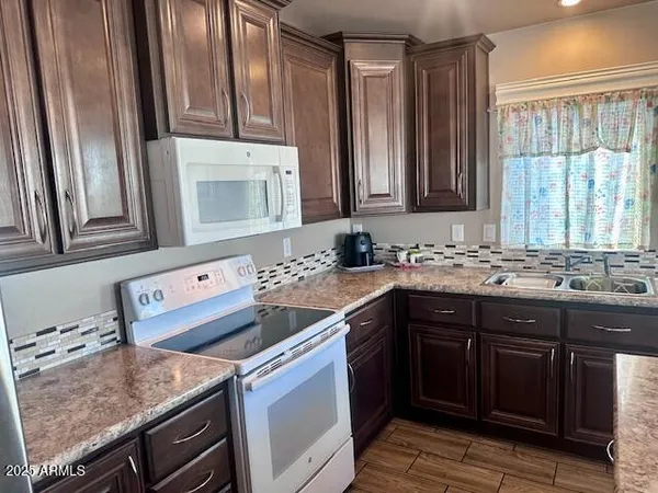a view of a refrigerator in kitchen