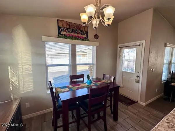 a kitchen with granite countertop a refrigerator and a sink