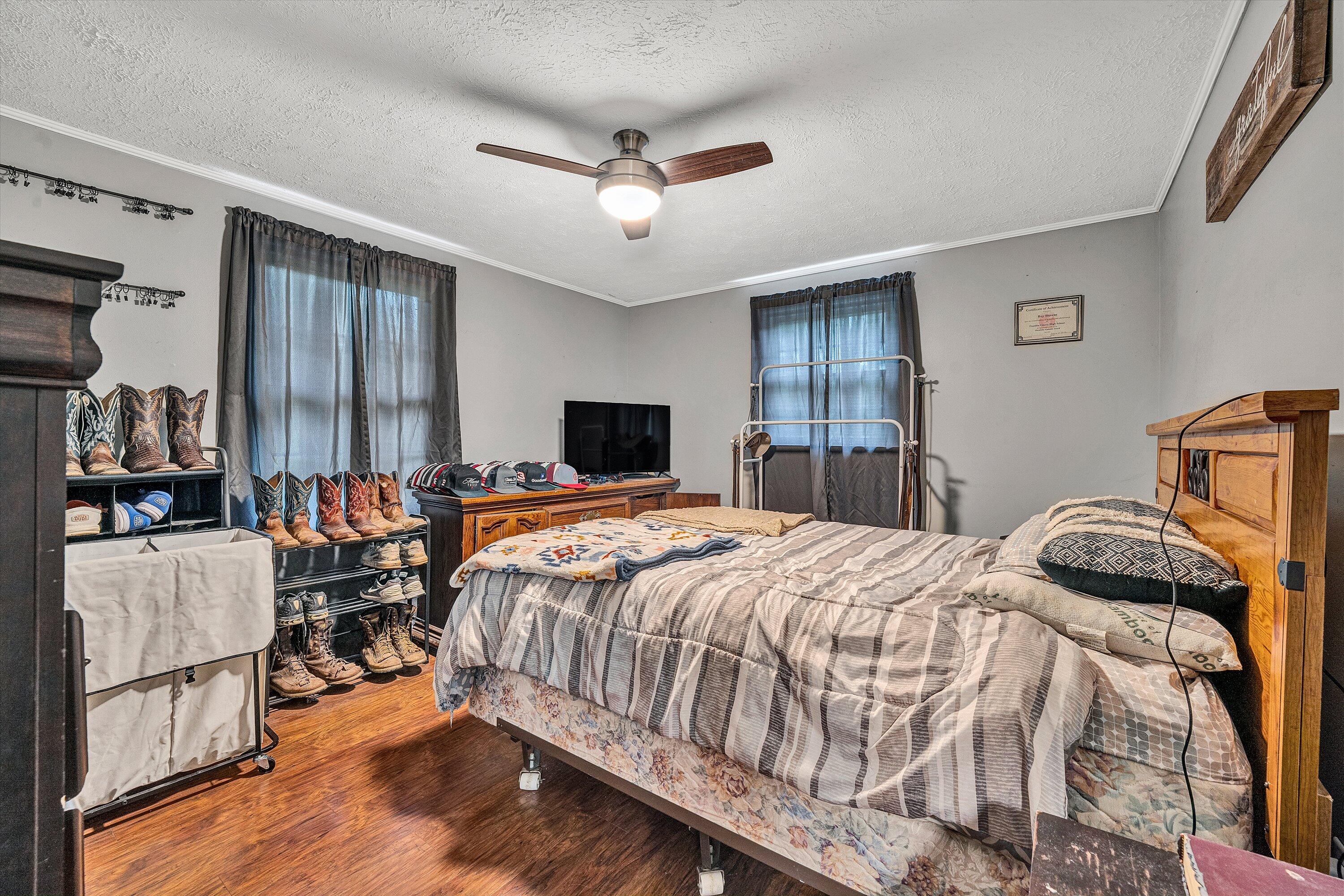 2095 Webster Road Glade Hill, VA 24092 - Photo 7 of 20 a bedroom with a bed and wooden floor