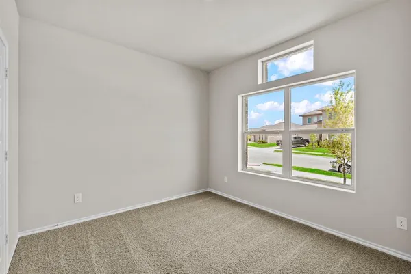 an empty room that has a window