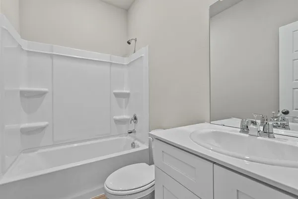 a bathroom with a sink a toilet and bathtub